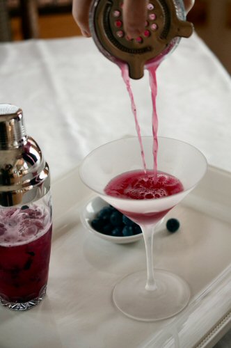 Pouring a Blueberry Martini
